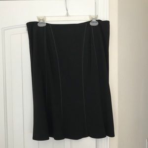 Black Skirt, fitted with a flare at bottom